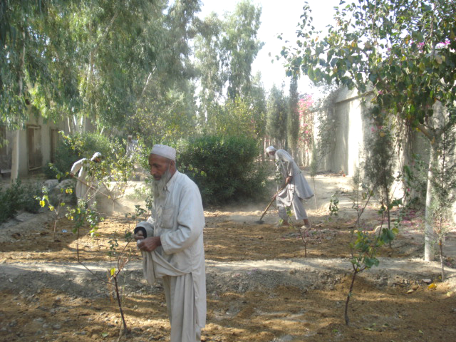 Farmers preparing the ground for planting seeds.